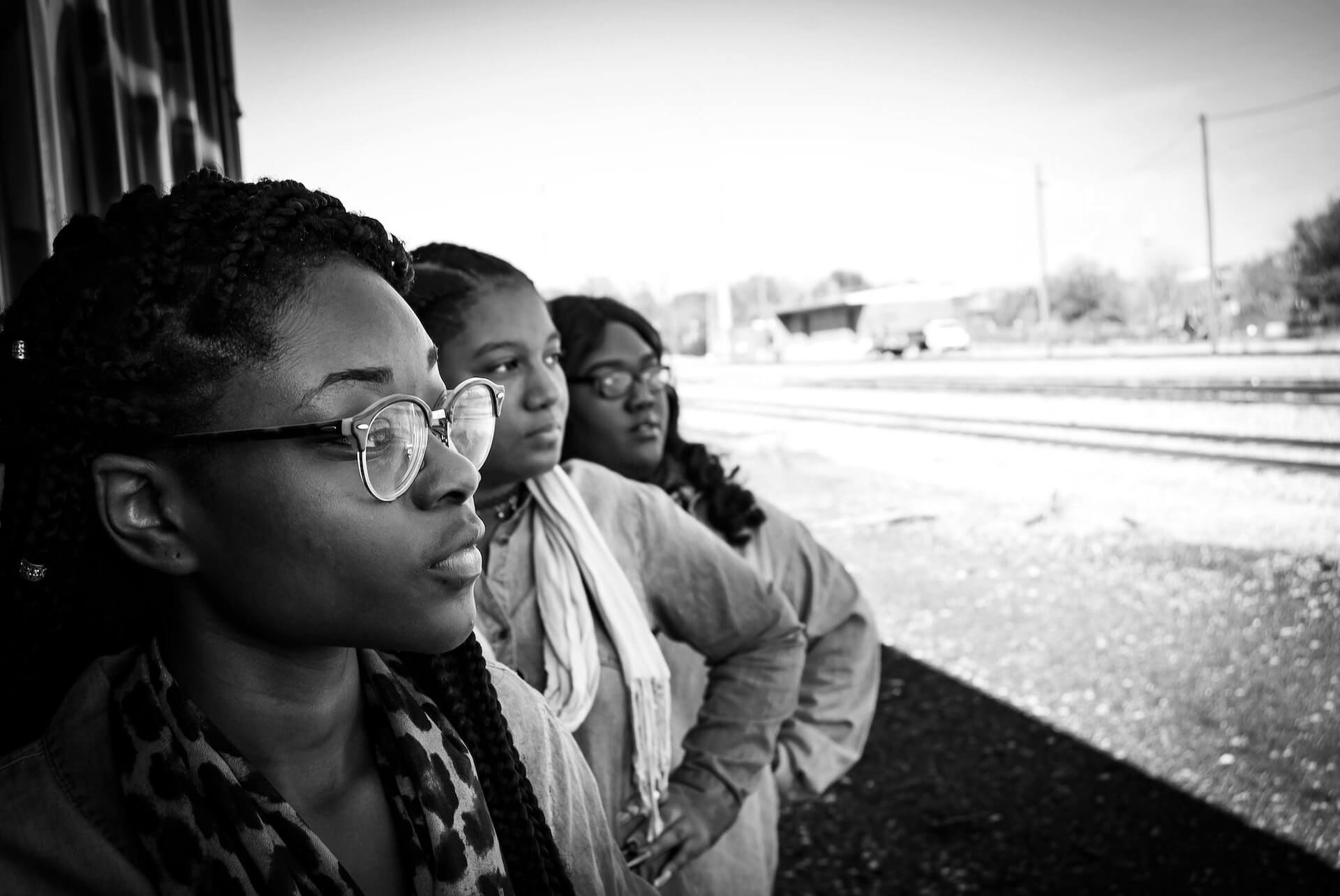 Black women looking out. Black History Month is a chance for Black people in the UK to celebrate Black identity, heritage, culture and experiences openly.